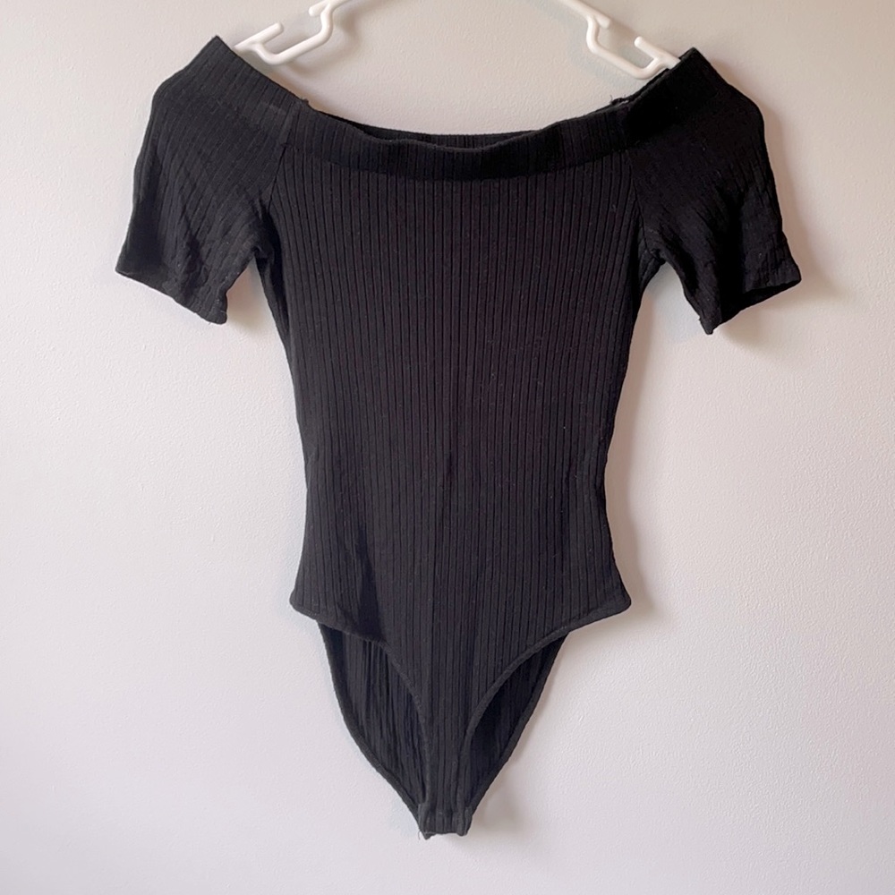 Black off the shoulder body suit.